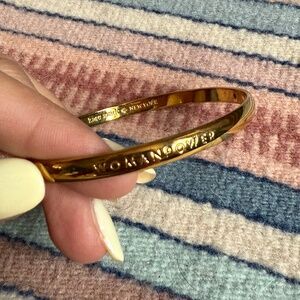 Kate Spade “Woman Power” Gold-Tone Bangle